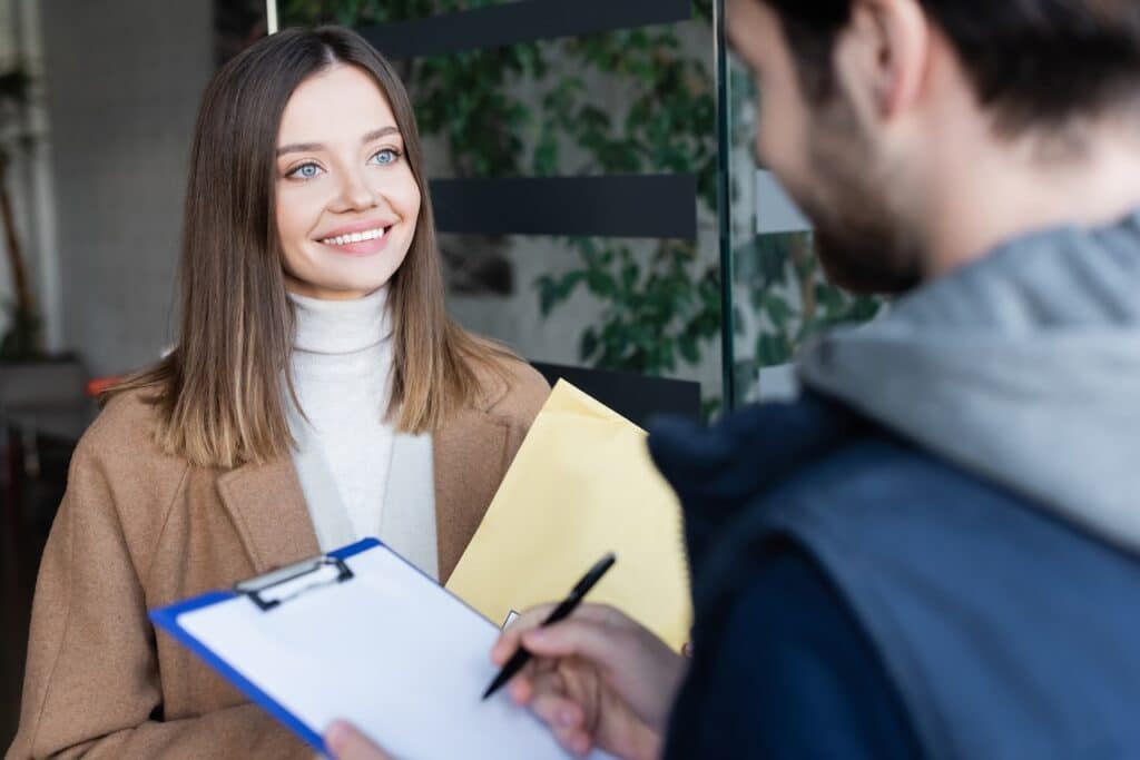 Man doing a tenant screening with a woman