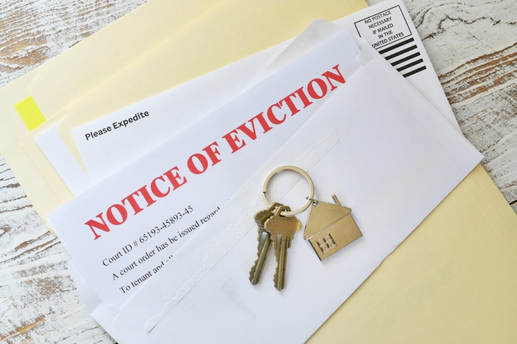 eviction notice with keys sitting on top of it