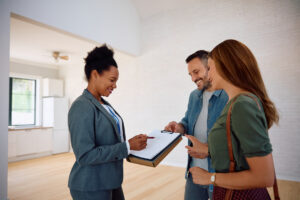 Happy couple looking over real estate documents